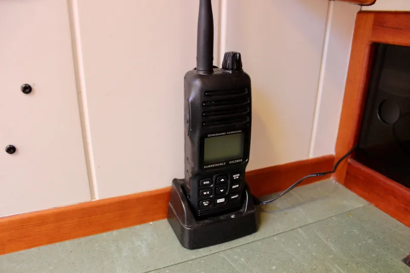 La Vie En Rose Yacht Photos Pics Handheld radio on charging dock inside 2012 Custom Gartside Jespersen 40 boat.