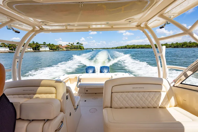  Yacht Photos Pics 2018 Grady-White Freedom 335 cruising on a sunny day, view from the cockpit.