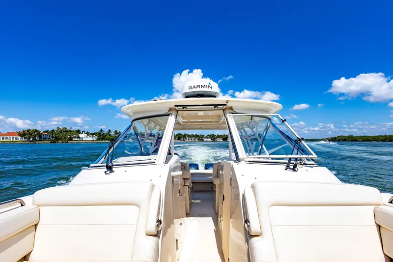  Yacht Photos Pics 2018 Grady-White Freedom 335 boat cruising on a sunny day.