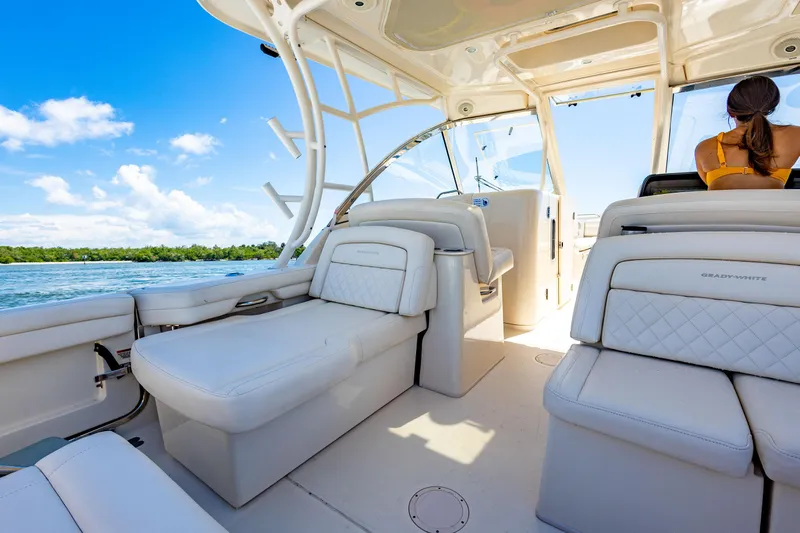  Yacht Photos Pics 2018 Grady-White Freedom 335 boat interior with white seating and ocean view.