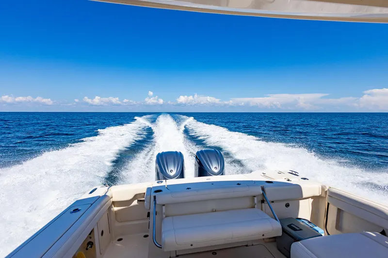  Yacht Photos Pics 2018 Grady-White Freedom 335 boat cruising on open ocean.