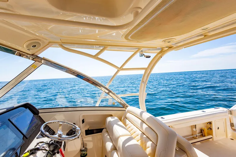  Yacht Photos Pics Interior view of 2018 Grady-White Freedom 335 boat on open water.