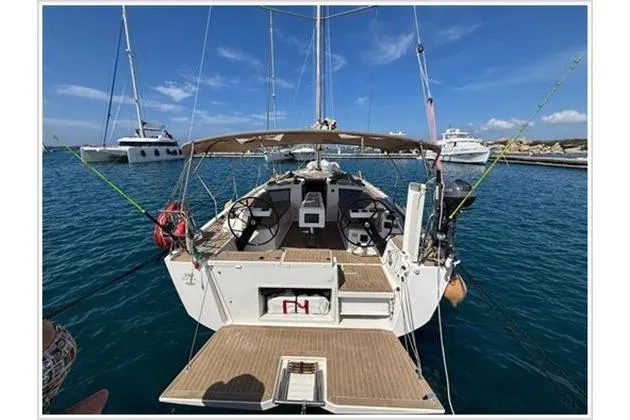  Yacht Photos Pics Sailing yacht Dufour 390 Grand Large 2019 docked in a marina, rear view.