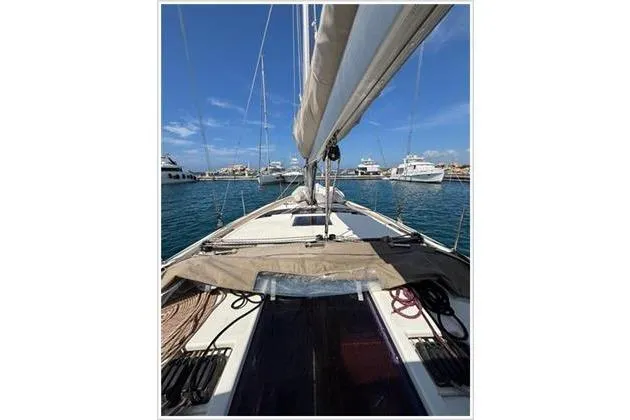  Yacht Photos Pics 2019 Dufour 390 Grand Large sailboat docked in a marina, clear blue sky.