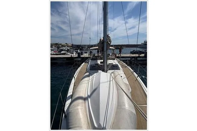  Yacht Photos Pics Dufour 390 Grand Large 2019 yacht docked at marina under blue sky.