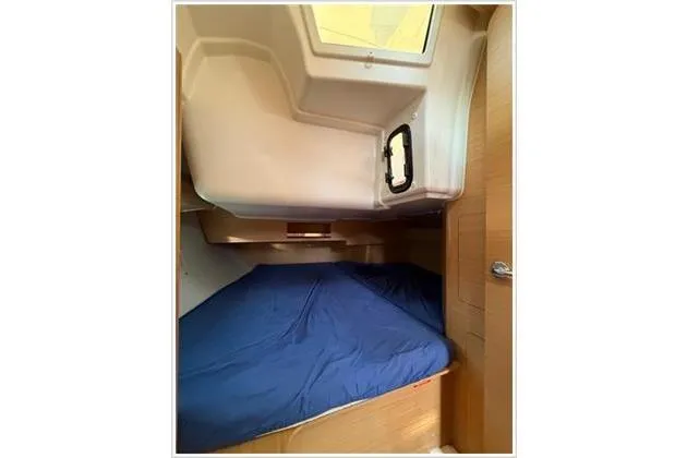  Yacht Photos Pics Cabin interior of 2019 Dufour 390 Grand Large with blue bedding.