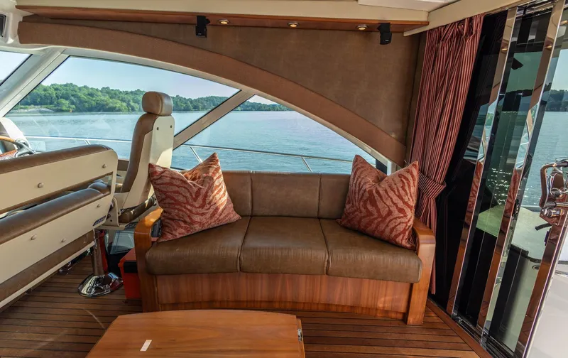  Yacht Photos Pics Luxurious 2006 Sea Ray 60 Sundancer interior with leather seating and scenic water view.