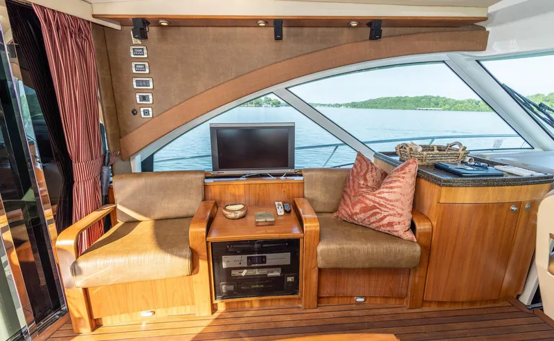  Yacht Photos Pics Luxurious interior of 2006 Sea Ray 60 Sundancer yacht with seating and entertainment area.