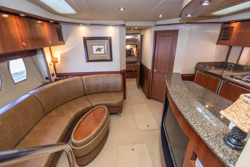  Yacht Photos Pics Luxurious interior of 2006 Sea Ray 60 Sundancer yacht with elegant seating and modern amenities.