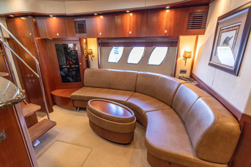  Yacht Photos Pics Luxurious interior of 2006 Sea Ray 60 Sundancer yacht with leather seating and elegant wood finishes.