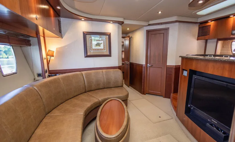  Yacht Photos Pics Luxurious interior of 2006 Sea Ray 60 Sundancer yacht with elegant seating and modern amenities.