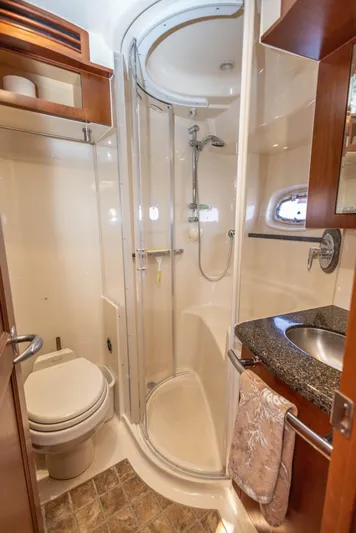  Yacht Photos Pics Luxurious bathroom in 2006 Sea Ray 60 Sundancer yacht with shower and sink.
