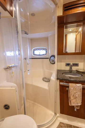  Yacht Photos Pics Luxurious bathroom in 2006 Sea Ray 60 Sundancer yacht with shower and sink.