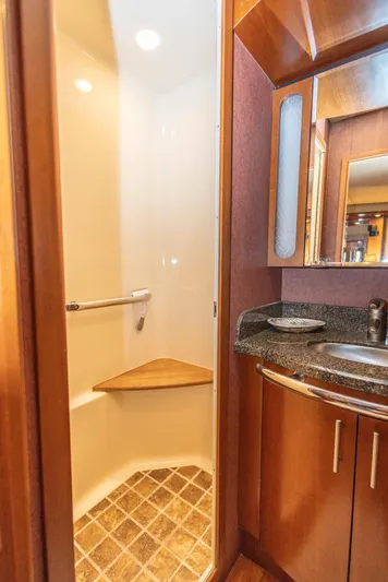  Yacht Photos Pics Luxurious bathroom in 2006 Sea Ray 60 Sundancer yacht with modern fixtures and wood accents.