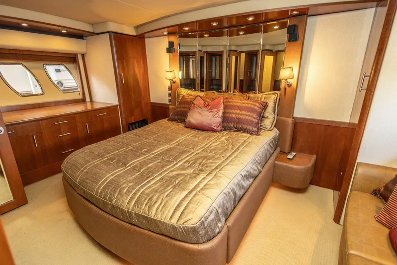  Yacht Photos Pics Luxurious bedroom interior of 2006 Sea Ray 60 Sundancer yacht with elegant bedding and wood finishes.