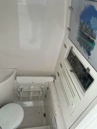No Name Yacht Photos Pics Interior of 2008 Jupiter 31 FS Center Console boat with storage and seating.