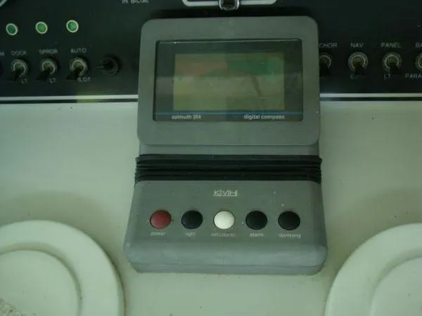  Yacht Photos Pics Digital compass on 1988 Chris-Craft Constellation boat dashboard with control buttons.