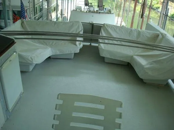  Yacht Photos Pics 1988 Chris-Craft Constellation boat deck with covered seating and railing.