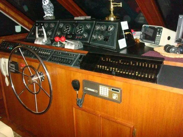  Yacht Photos Pics 1988 Chris-Craft Constellation helm with classic wooden dashboard and navigation instruments.