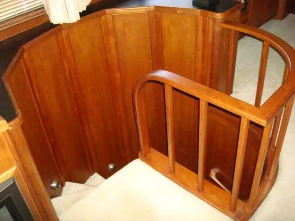  Yacht Photos Pics Wooden staircase on 1988 Chris-Craft Constellation yacht interior.