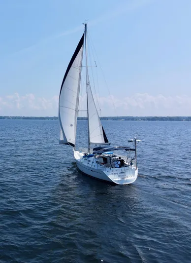 Danae Yacht Photos Pics Sailing yacht Beneteau Oceanis Clipper 393, 2003 model, cruising on open water.