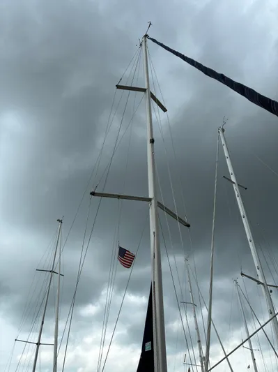 Danae Yacht Photos Pics Masts of a 2003 Beneteau Oceanis Clipper 393 sailboat under cloudy skies.