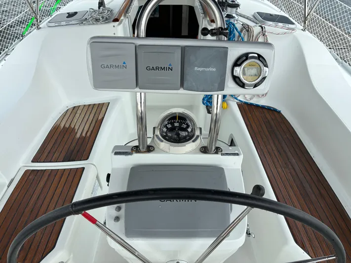 Danae Yacht Photos Pics Cockpit of 2003 Beneteau Oceanis Clipper 393 with Garmin and Raymarine navigation systems.