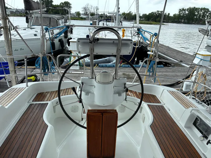Danae Yacht Photos Pics Cockpit view of 2003 Beneteau Oceanis Clipper 393 sailboat docked at marina.