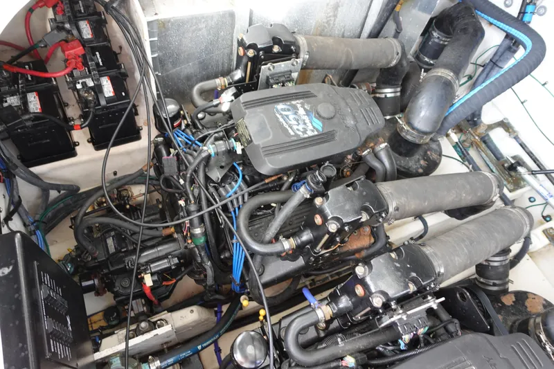  Yacht Photos Pics Engine compartment of a 2007 Sea Ray 320 Sundancer, showcasing complex mechanical components.