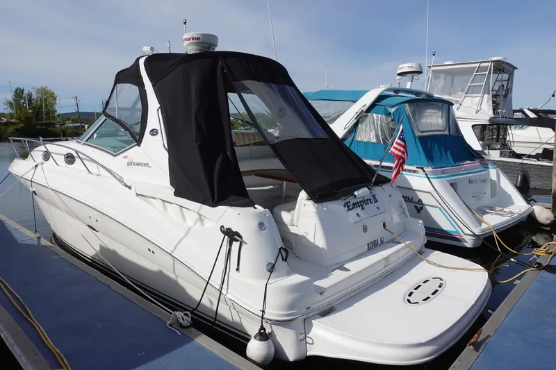  Yacht Photos Pics 2007 Sea Ray 320 Sundancer docked at marina, featuring sleek design and American flag.