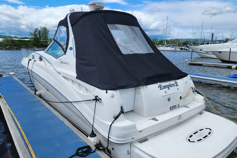  Yacht Photos Pics 2007 Sea Ray 320 Sundancer docked at marina with black canopy.