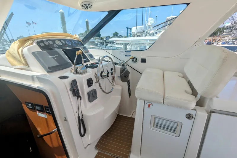  Yacht Photos Pics 2007 Tiara Yachts 3600 Sovran helm with steering wheel and navigation controls.