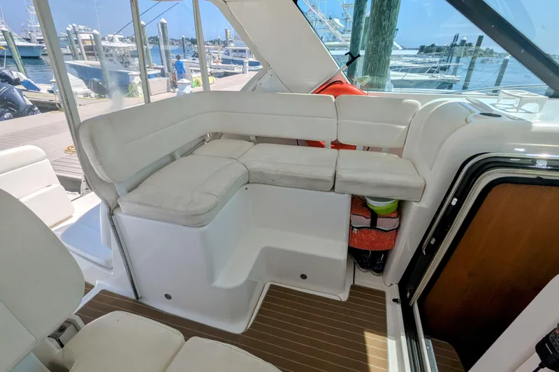  Yacht Photos Pics 2007 Tiara Yachts 3600 Sovran interior with white seating and marina view.
