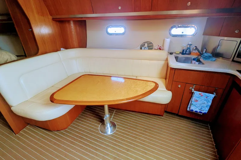  Yacht Photos Pics 2007 Tiara Yachts 3600 Sovran interior with dining area and kitchenette.