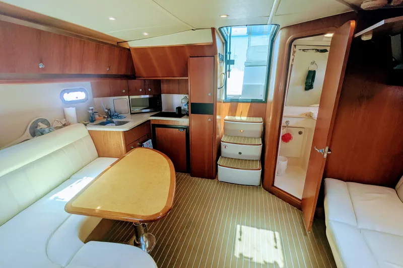  Yacht Photos Pics Luxurious interior of 2007 Tiara Yachts 3600 Sovran with wood finishes and cozy seating.