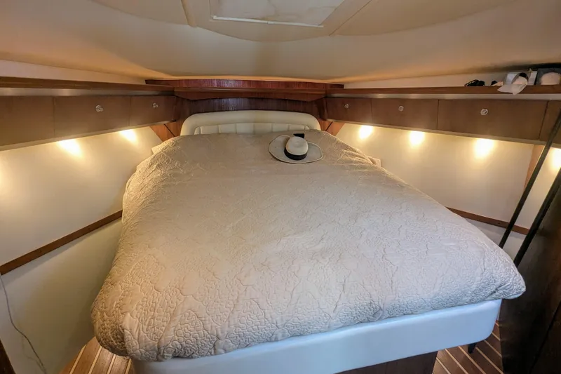  Yacht Photos Pics Luxurious cabin interior of 2007 Tiara Yachts 3600 Sovran with cozy bed and ambient lighting.