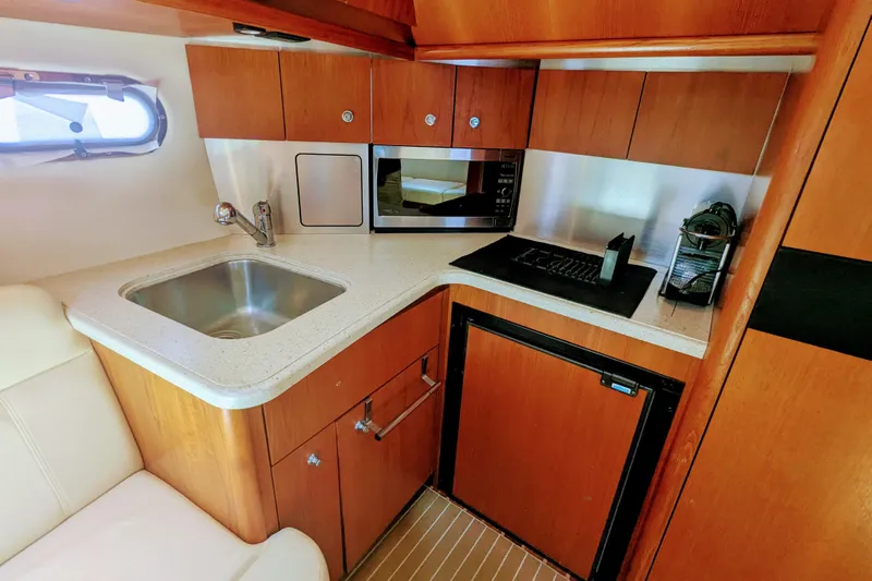  Yacht Photos Pics 2007 Tiara Yachts 3600 Sovran galley with sink, microwave, and compact fridge.