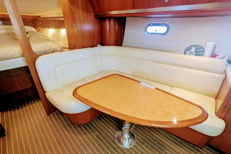  Yacht Photos Pics 2007 Tiara Yachts 3600 Sovran interior with cozy seating and elegant wooden table.