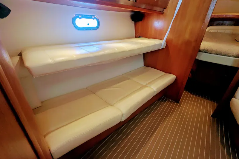  Yacht Photos Pics 2007 Tiara Yachts 3600 Sovran interior with bunk beds and wooden finish.