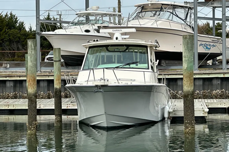  Yacht Photos Pics 2024 Grady-White Express 330 boat docked in marina, front view.