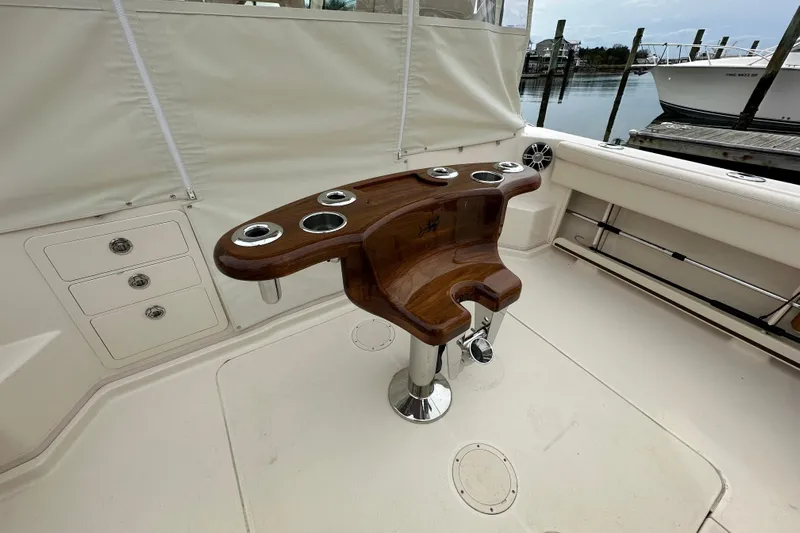  Yacht Photos Pics 2024 Grady-White Express 330 boat interior with wooden fishing rod holder.
