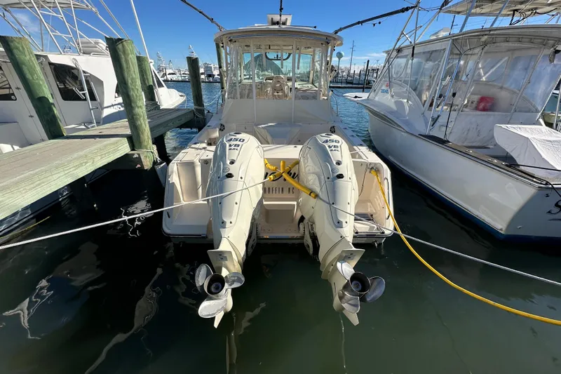  Yacht Photos Pics 2024 Grady-White Express 330 boat docked with twin outboard engines.