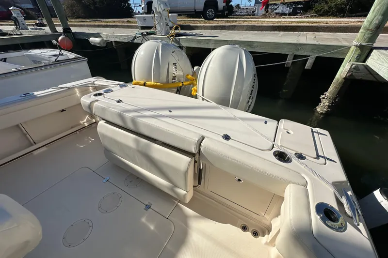  Yacht Photos Pics 2024 Grady-White Express 330 boat interior with seating and twin outboard motors.