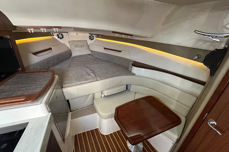  Yacht Photos Pics 2024 Grady-White Express 330 cabin interior with seating and table.