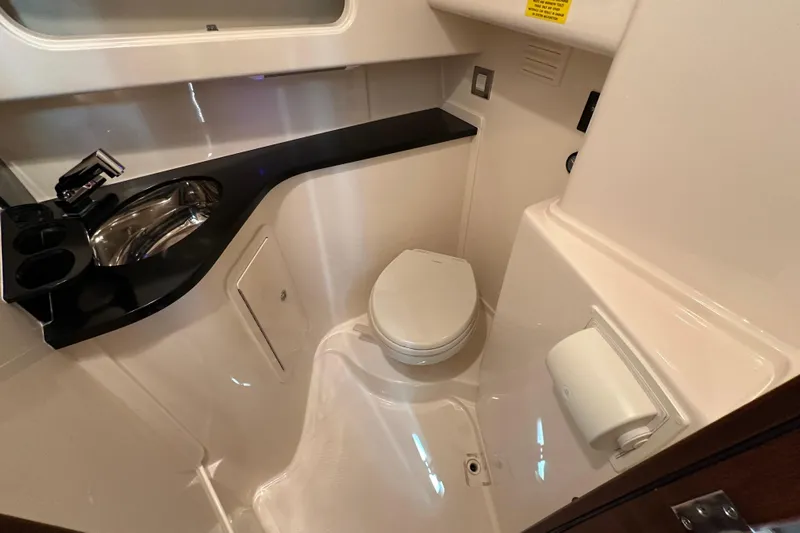  Yacht Photos Pics 2024 Grady-White Express 330 boat bathroom with sink and toilet.