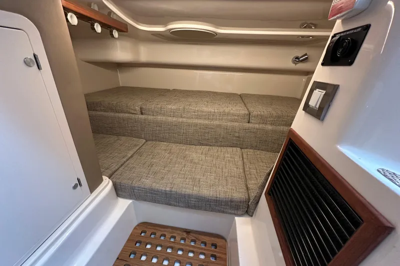  Yacht Photos Pics 2024 Grady-White Express 330 cabin interior with cushioned seating and modern amenities.