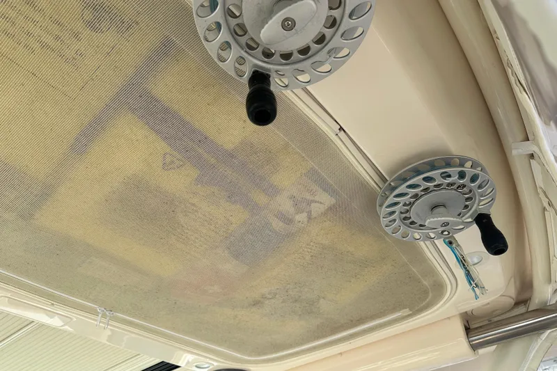  Yacht Photos Pics 2024 Grady-White Express 330 boat interior with fishing reel holders.