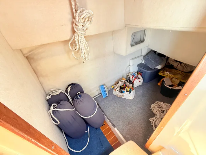 Sam Mcgee Yacht Photos Pics Interior storage area of 2009 Ranger Tugs R-29 boat with ropes and tools.