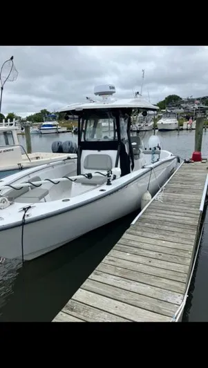  Yacht Photos Pics 2023 Cape Horn 27 XS boat docked at a marina on a cloudy day.