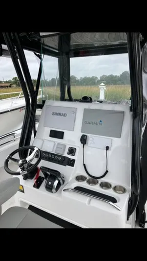  Yacht Photos Pics 2023 Cape Horn 27 XS boat dashboard with Simrad and Garmin displays.